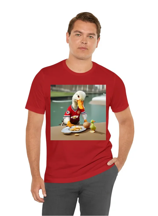 A duck wearing a man u jersey eating